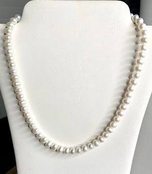#260 6mm white pearl strung 17”