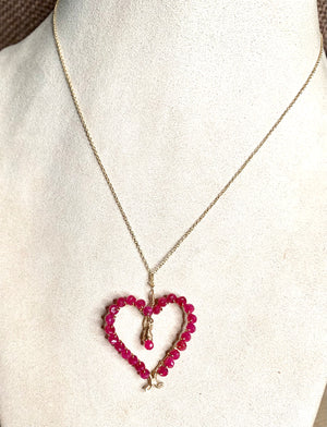 #375 heart wrapped in rubies necklace