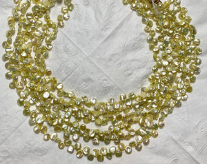 #145 yellow keishi pearls 29”